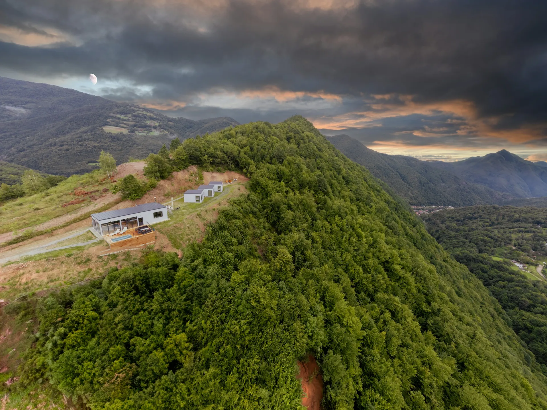 Mountain house above forested Carpathian ridges in Romania