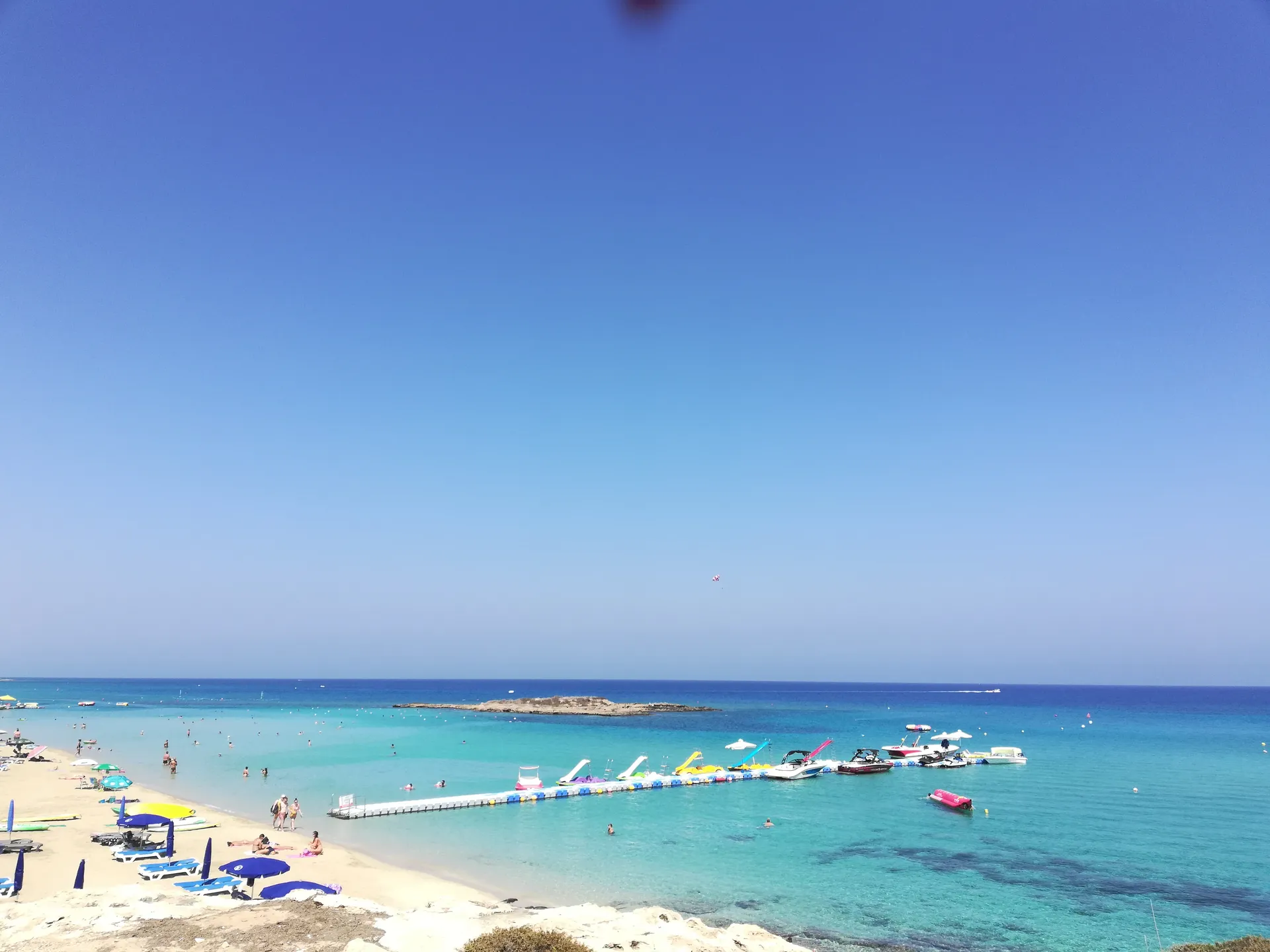 Clear turquoise water and pale sand at Fig Tree Beach in Cyprus