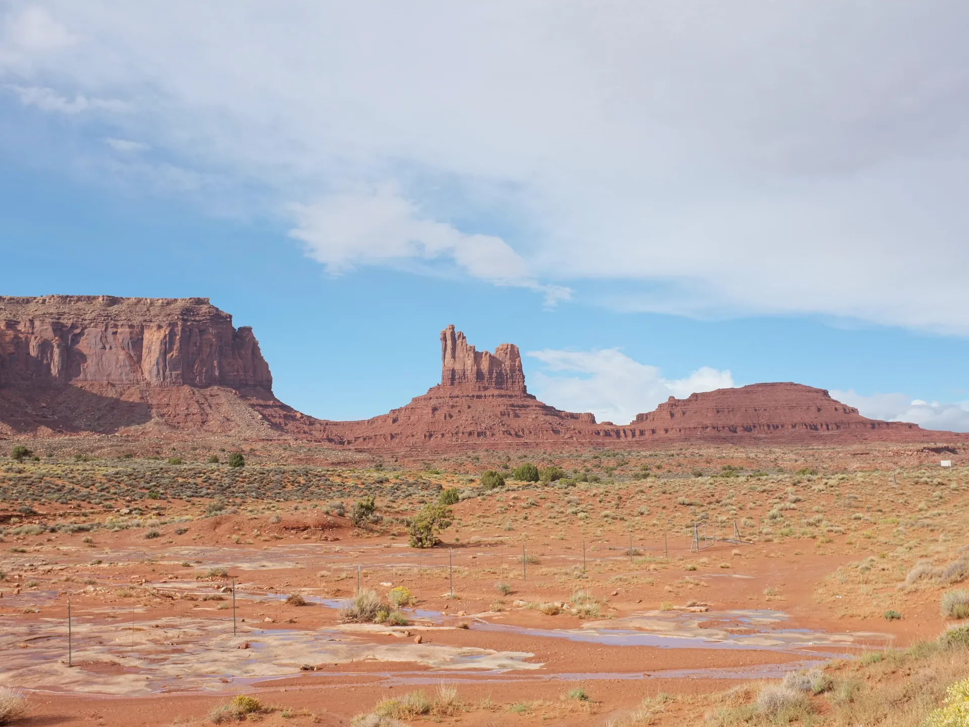 Red sandstone buttes and desert road in Valley of the Gods, Utah
