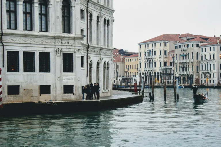 Venice canal and historic waterfront architecture in Italy