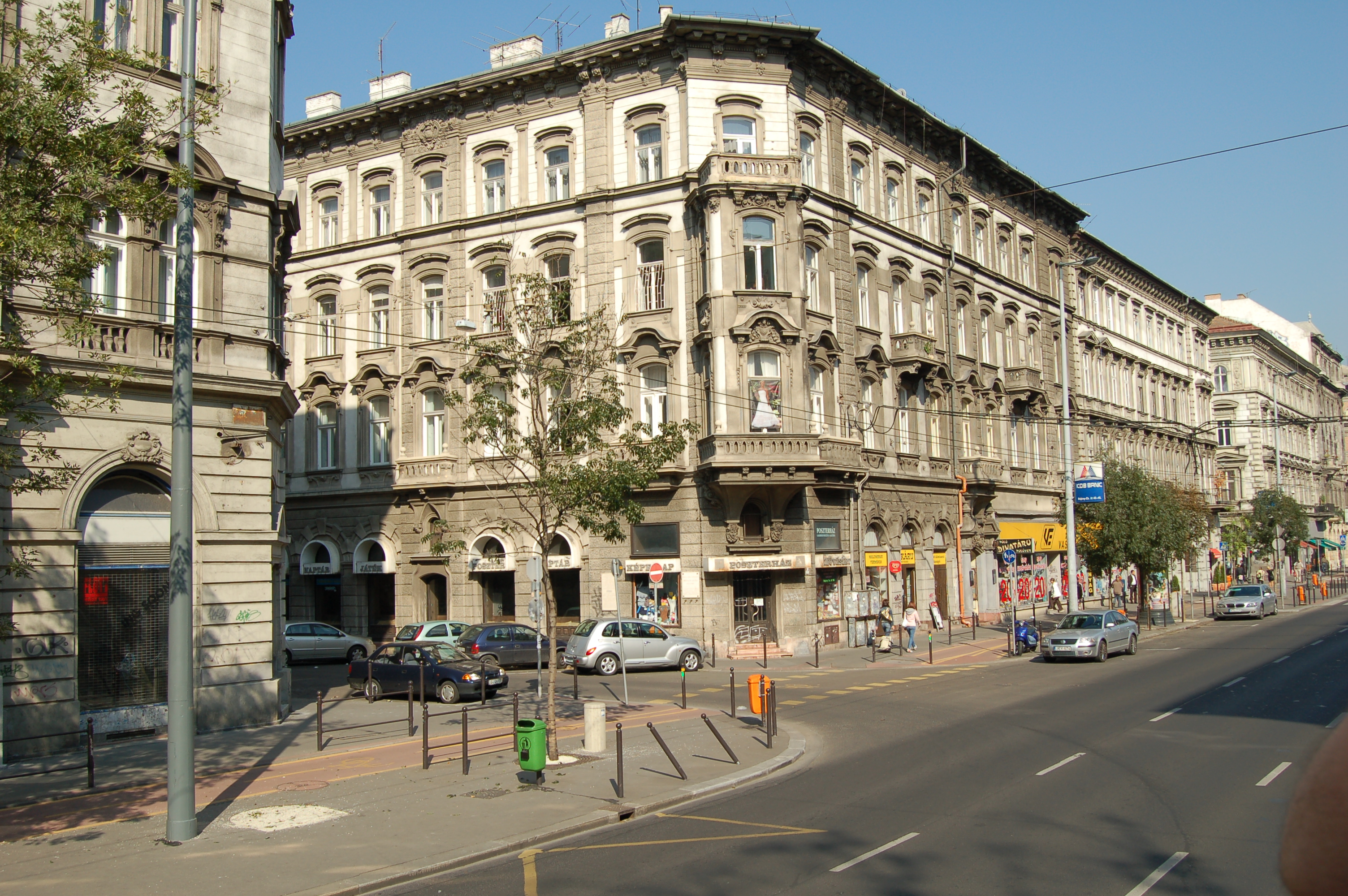 Sunlit historic apartment buildings on a Budapest street