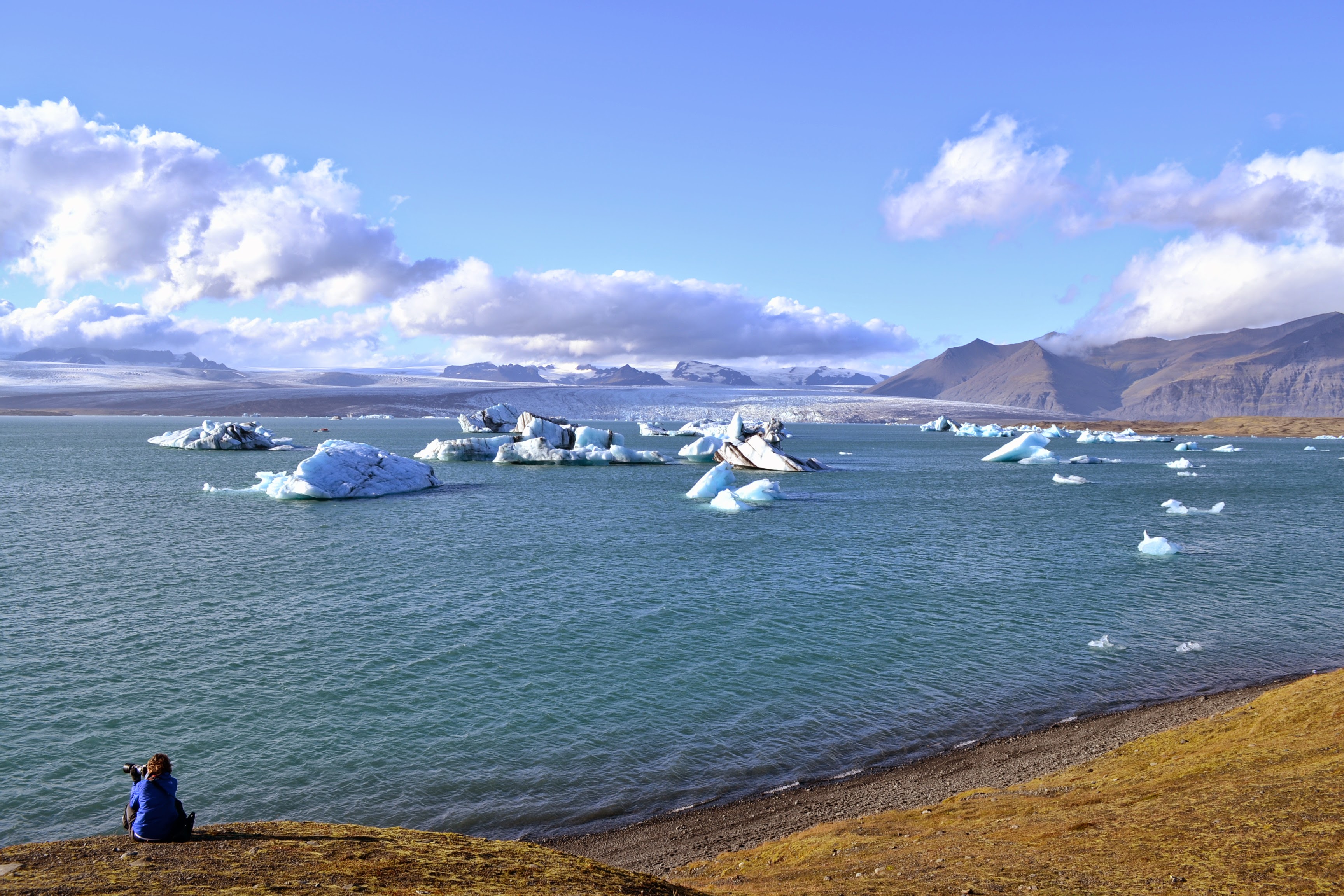 Icebergs and glacier views across an Icelandic lagoon