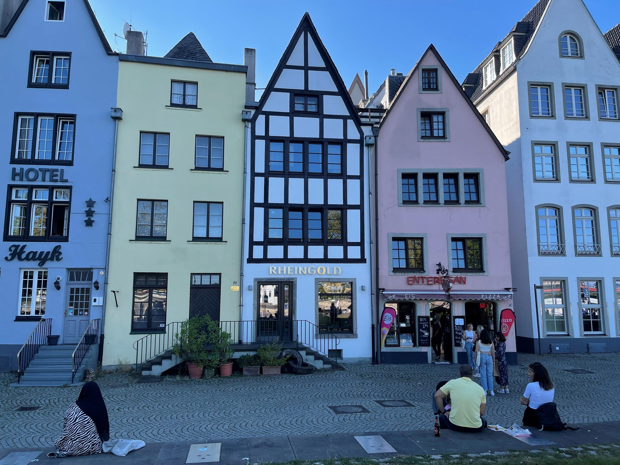 Row of colourful gabled Old Town houses including a half-timbered building at Cologne's Fischmarkt