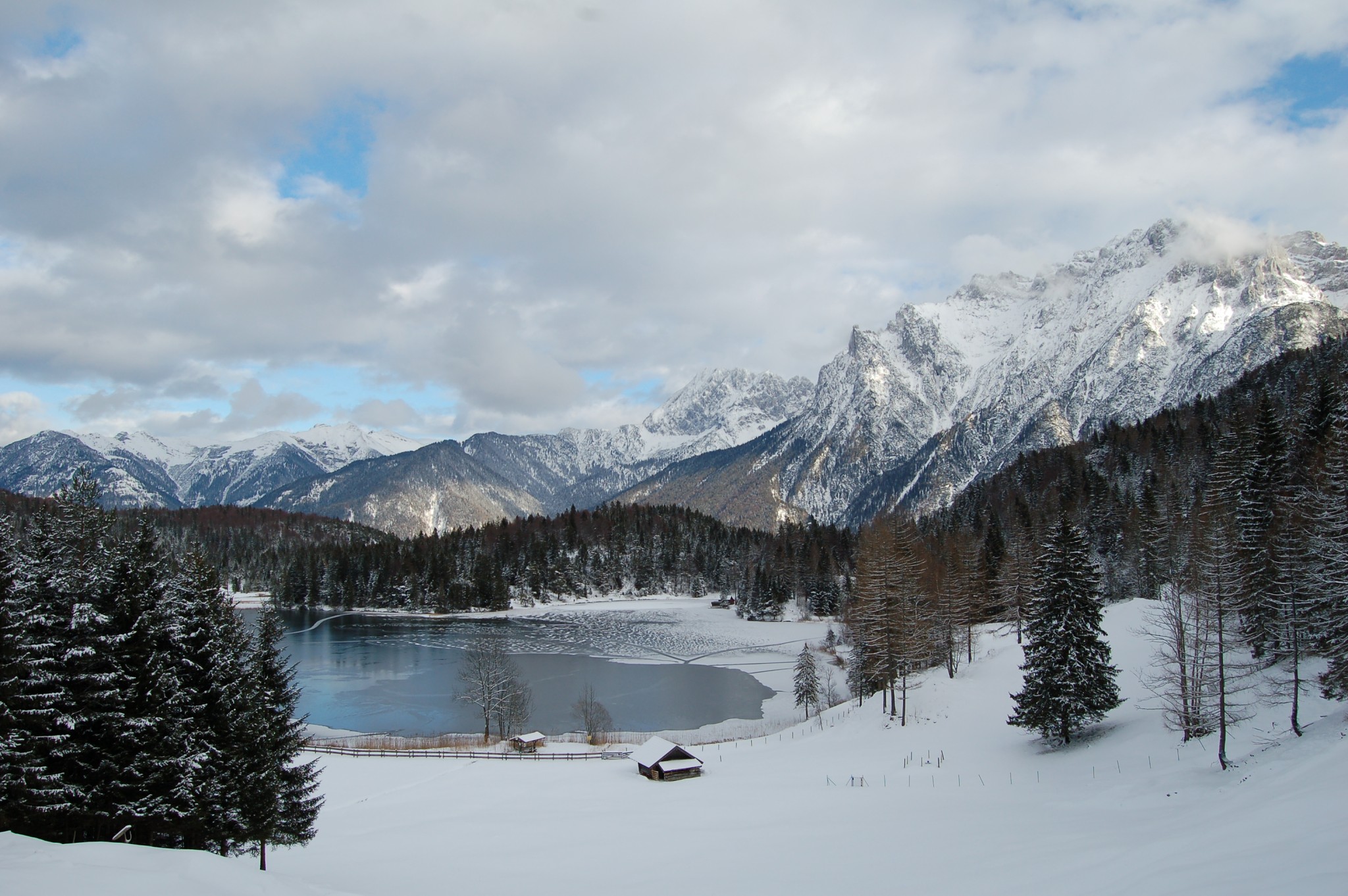 Snowy winter lake and Alpine mountains near Mittenwald