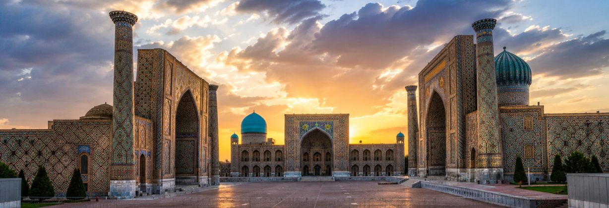 Registan Square at sunset with glowing clouds above the madrasas