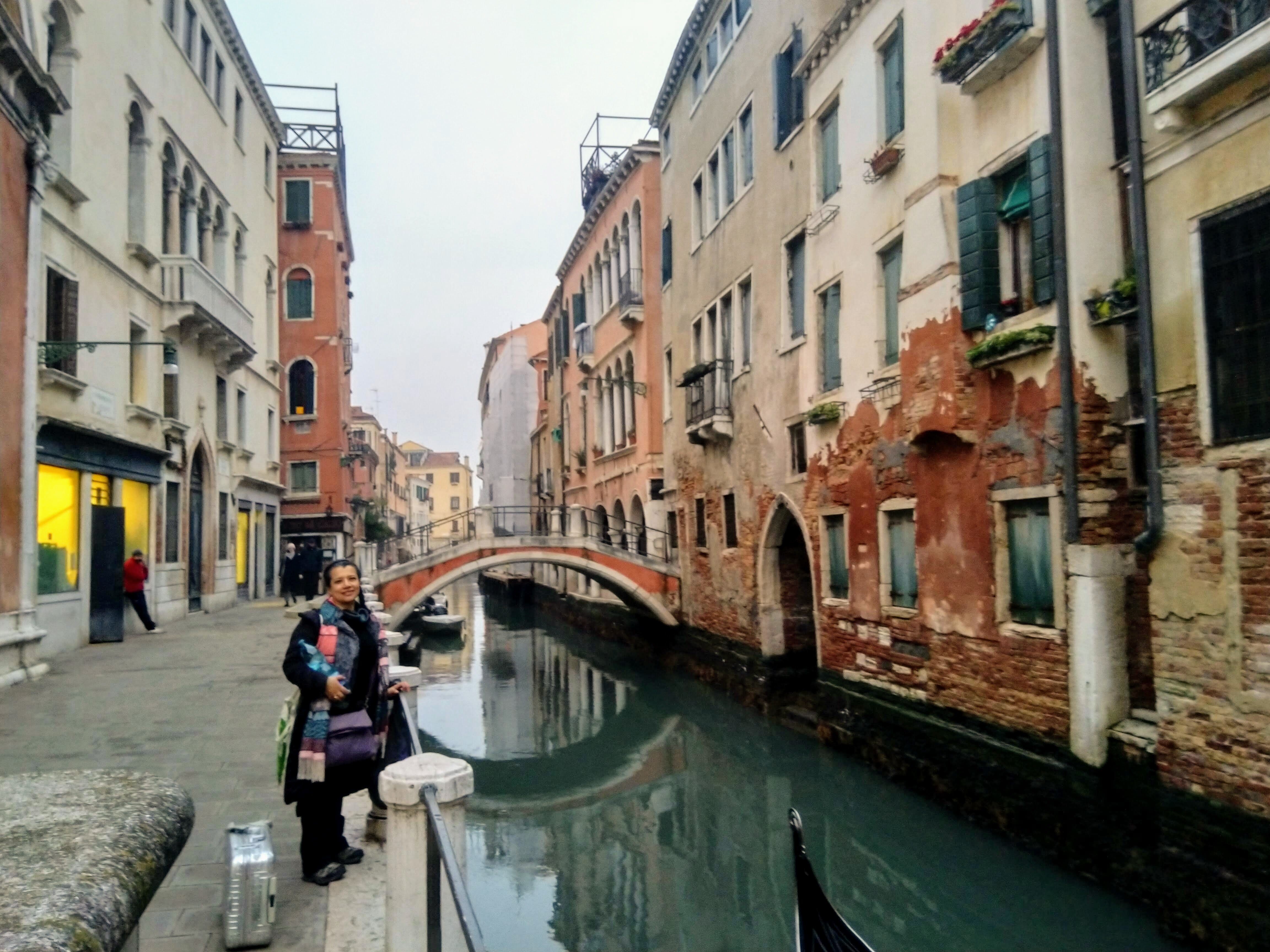 Venice canal with historic buildings and bridges