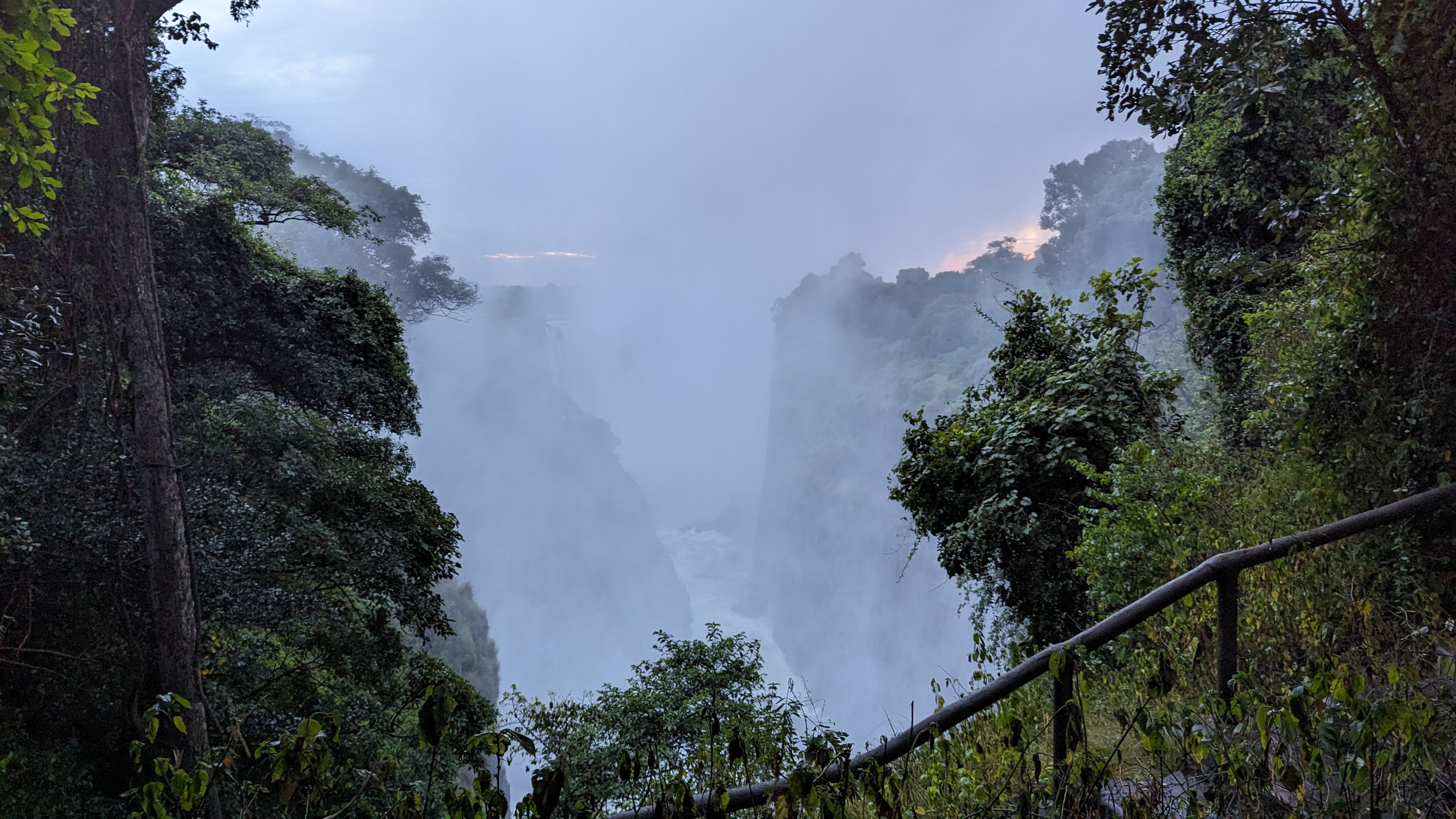 Victoria Falls with heavy spray rising from the Zambezi Gorge