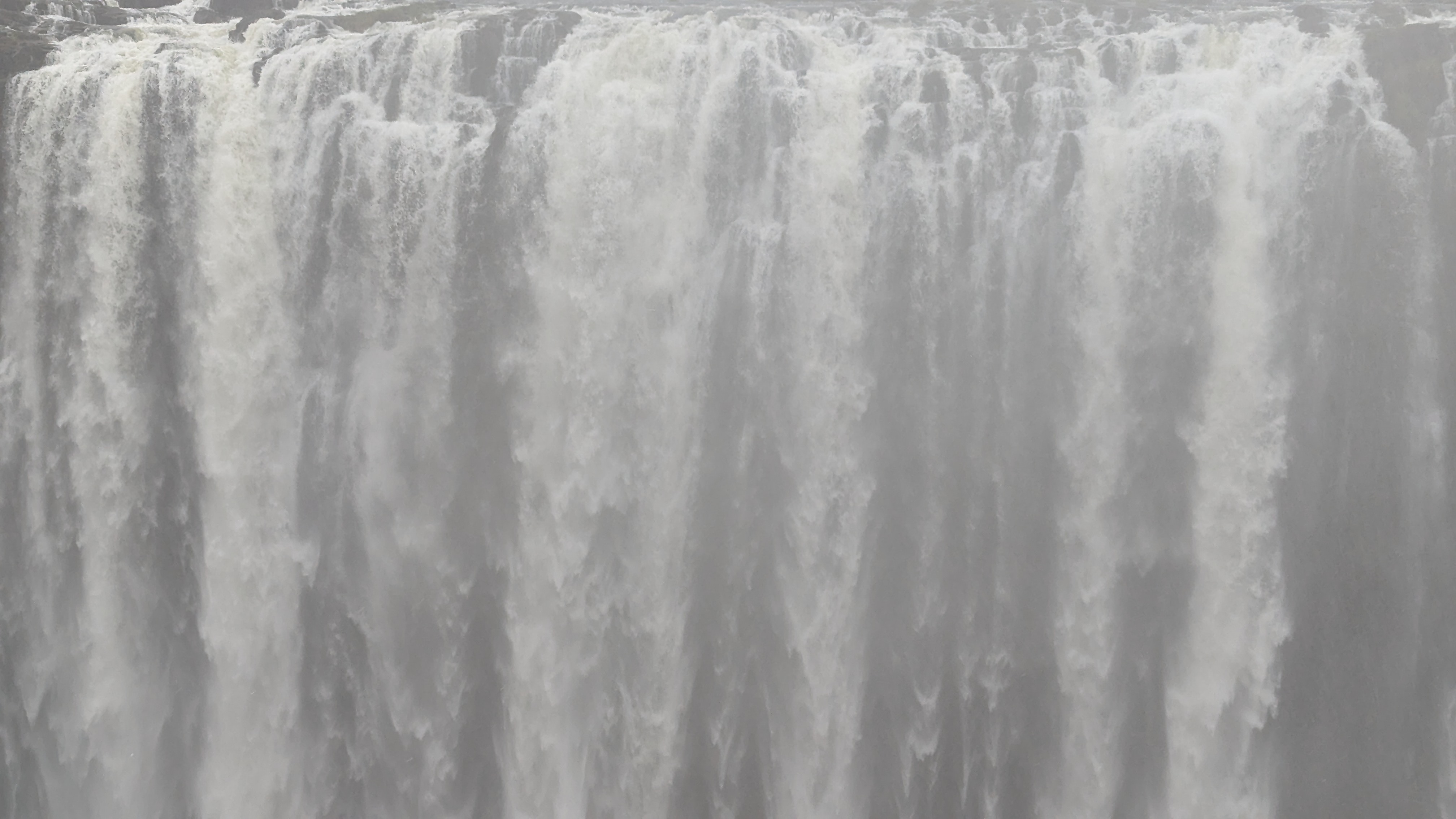 Victoria Falls viewpoint with water plunging into the gorge